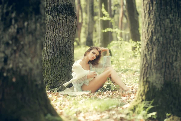 Young woman with goat in forest — Stock Photo, Image