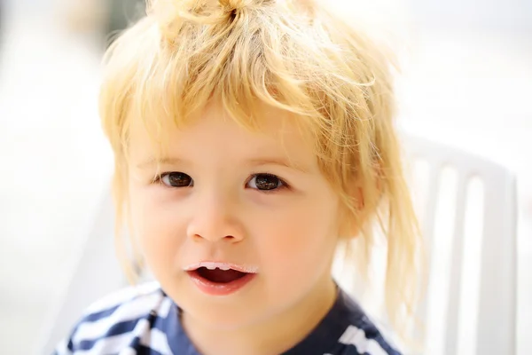 Baby boy with milk moustache — Stock Photo, Image