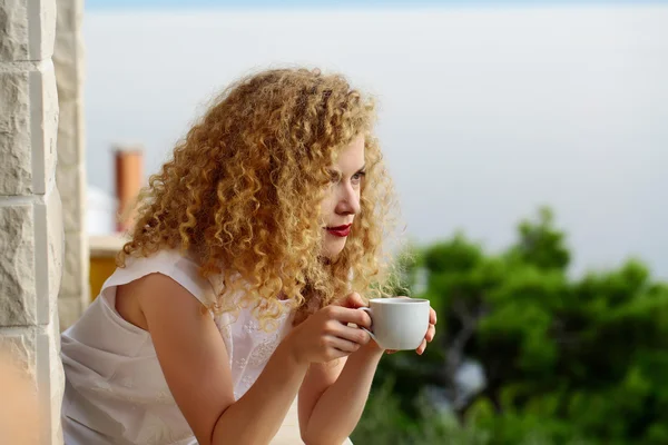 pretty woman with coffee cup