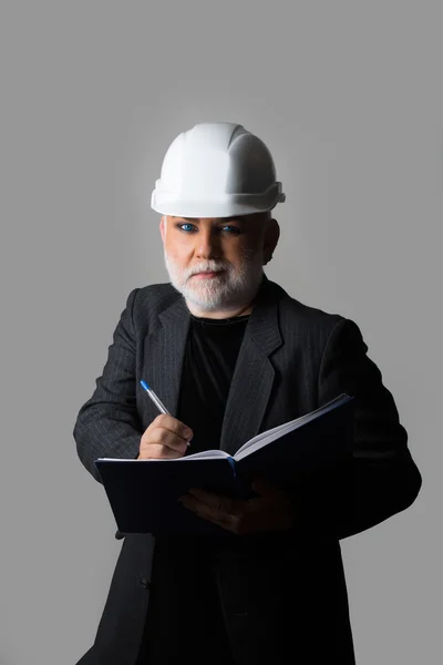 Hombre de sombrero duro con cuaderno —  Fotos de Stock