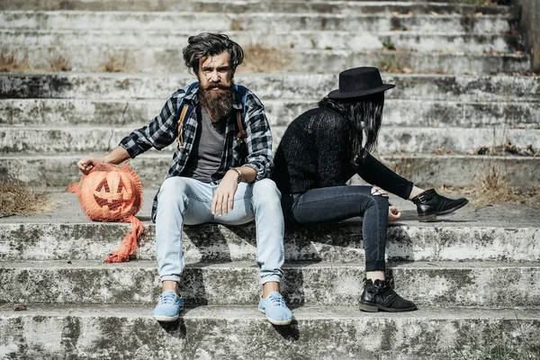 Halloween couple with pumpkin — Stock Photo, Image