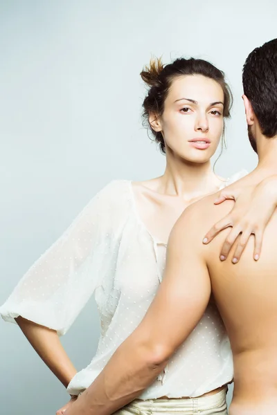 Young sexy couple in studio — Stock Photo, Image