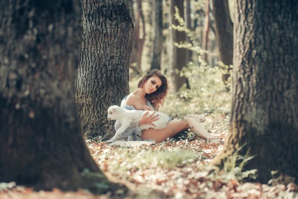 Young woman with goat in forest — Stock Photo, Image