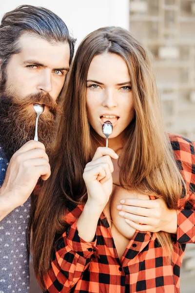 young couple with tea spoon