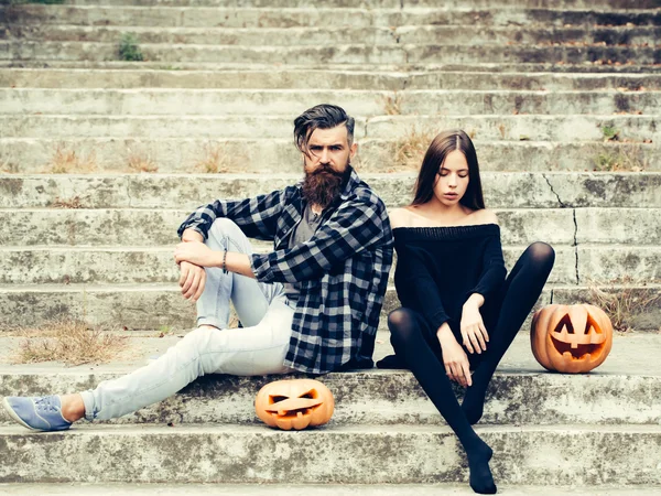 Halloween couple with pumpkin — Stock Photo, Image