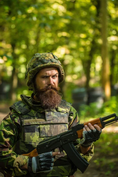 Bearded soldier in the forest — Stock Photo, Image