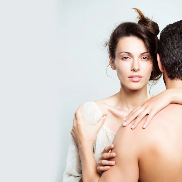 Young sexy couple in studio — Stock Photo, Image