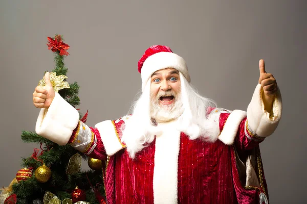 Santa ger dubbla tummar upp — Stockfoto
