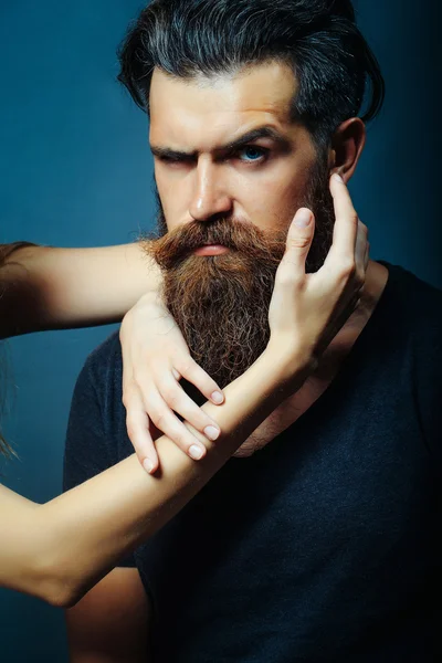 Female hands touch long beard — Stock Photo, Image