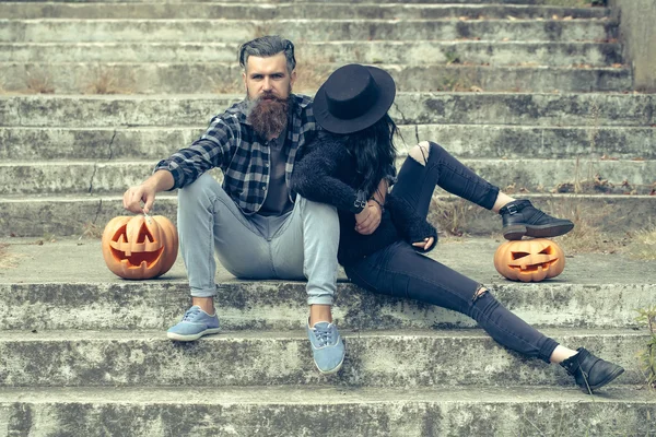 Halloween couple with pumpkin — Stock Photo, Image