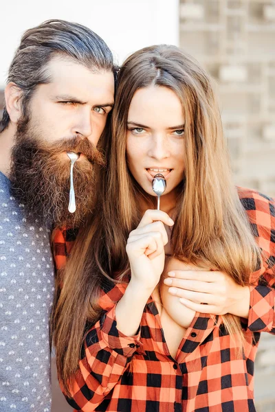 Young couple with tea spoon — Stock Photo, Image