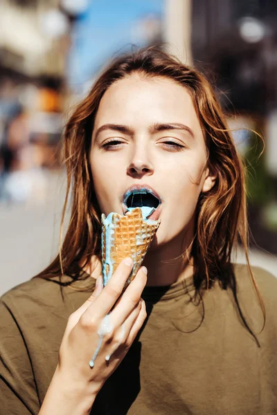 Young woman eating ice cream