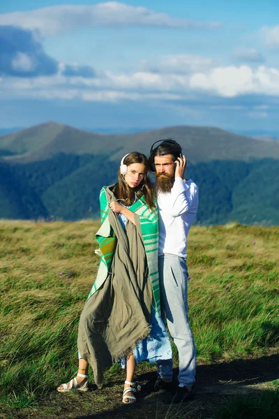 Young couple with headphones — Stock Photo, Image