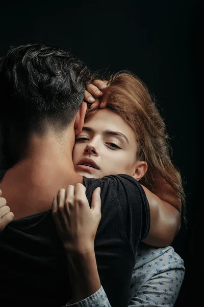 Pretty girl embraces man — Stock Photo, Image