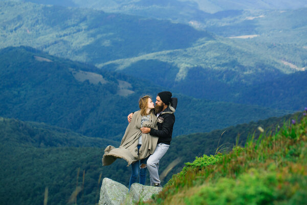 Romantic couple on mountain top