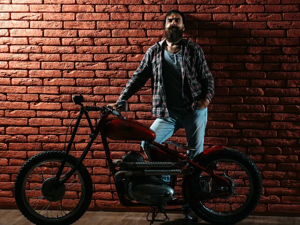 Bearded biker man on motorbike — Stock Photo, Image