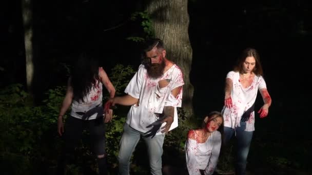 Four bloody zombies in the woods — Stockvideo