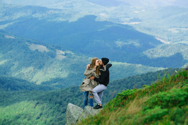 Romantic couple on mountain top