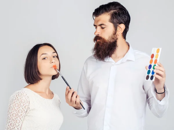 Couple with colorful paints — Stock Photo, Image