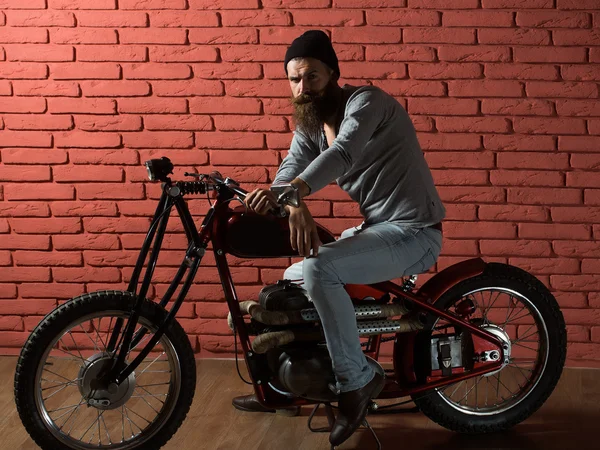 Bearded biker man on motorbike — Stock Photo, Image
