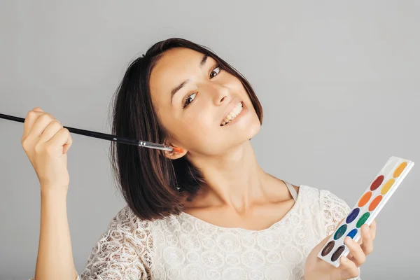 Girl with colorful paints — Stock Photo, Image