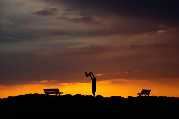 Father and child on sunset — Stock Photo, Image