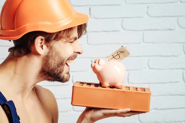 Sexy musculoso hombre constructor con dinero — Foto de Stock