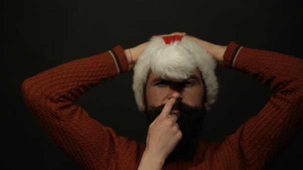 Female hand touches the nose and mustache santa claus — Stock Video