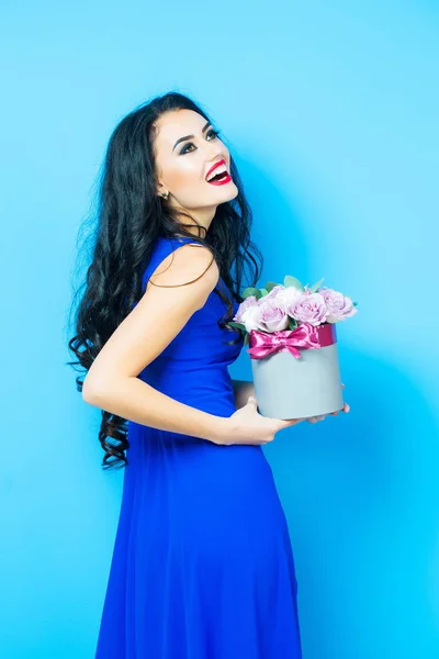 Sexy girl with roses on blue — Stock Photo, Image