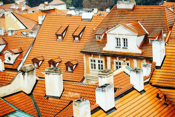 Terracotta tiled roofs with chimneys