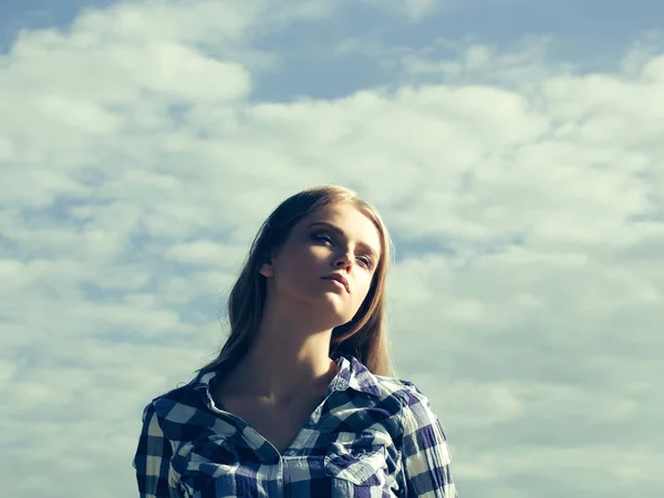 Pretty girl on cloudy sky — Stock Photo, Image