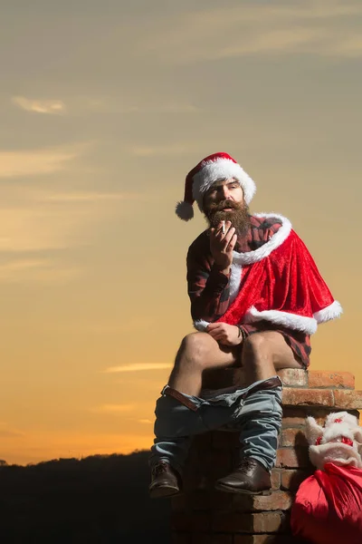 Christmas bad santa on chimney — Stock Photo, Image
