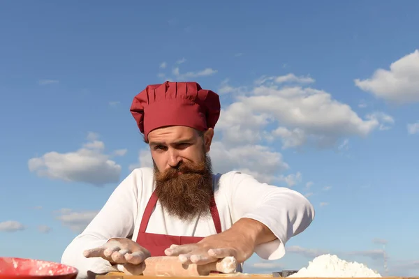 berded man chef cooking outdoor