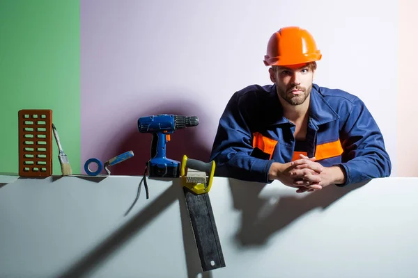 Handsome man builder with tools