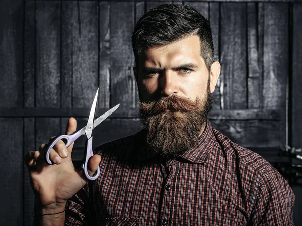 bearded man barber with scissors