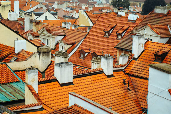 Terracotta tiled roofs with chimneys