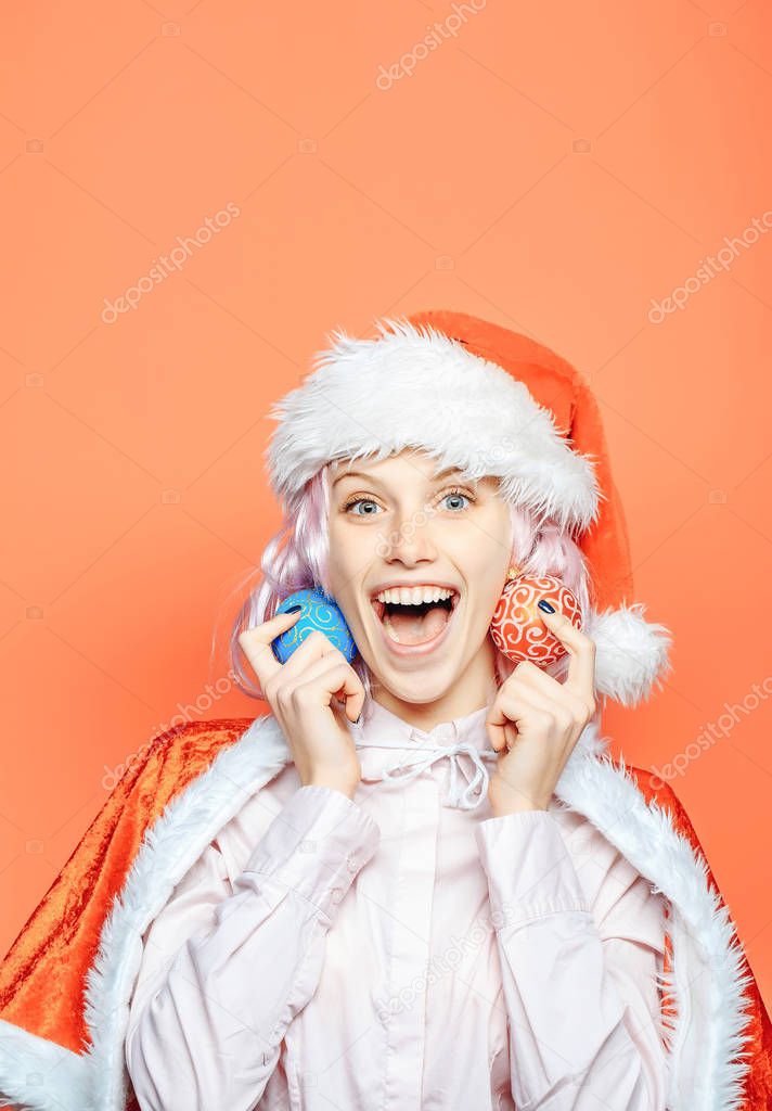 Excited girl with Christmas baubles