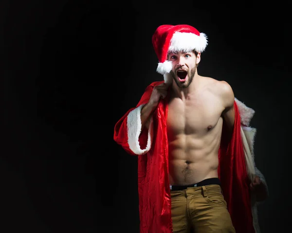 Handsome muscular christmas santa man — Stock Photo, Image