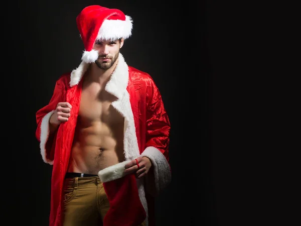 Handsome muscular christmas santa man — Stock Photo, Image