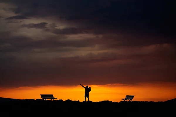 Father and child on sunset — Stock Photo, Image
