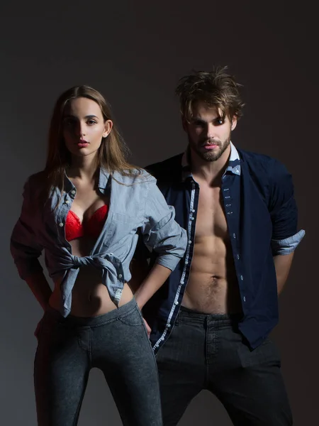 Young couple in unbutton shirts