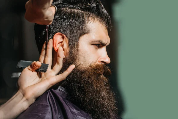 Handsome bearded man in barbershop — Stock Photo, Image