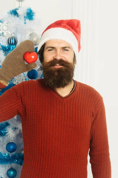 Christmas bearded man with heart — Stock Photo, Image