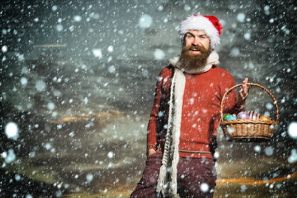 Christmas man with balls in basket — Stock Photo, Image
