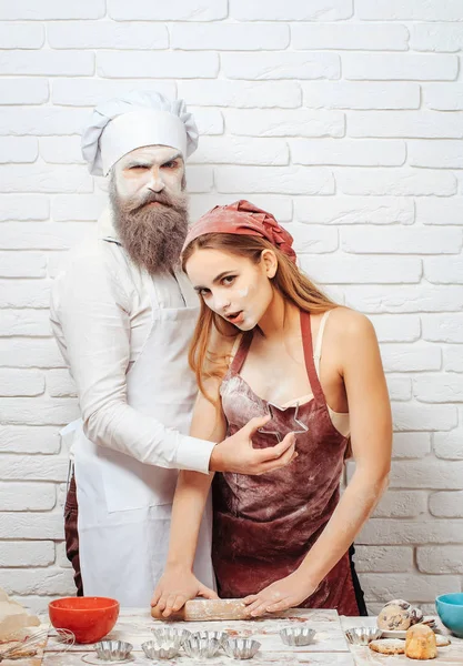 Baker and girl with star cutter — Stock Photo, Image