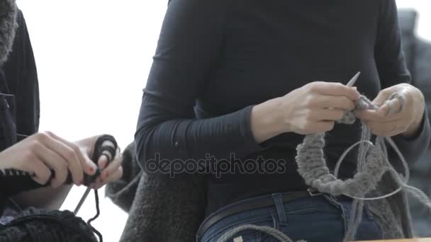 Two women knitting needles warm clothes for the winter — Stock Video