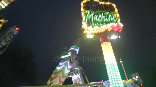 Prague - March 2016: Panning view of a colorful fun fair ride at night — Stock Video