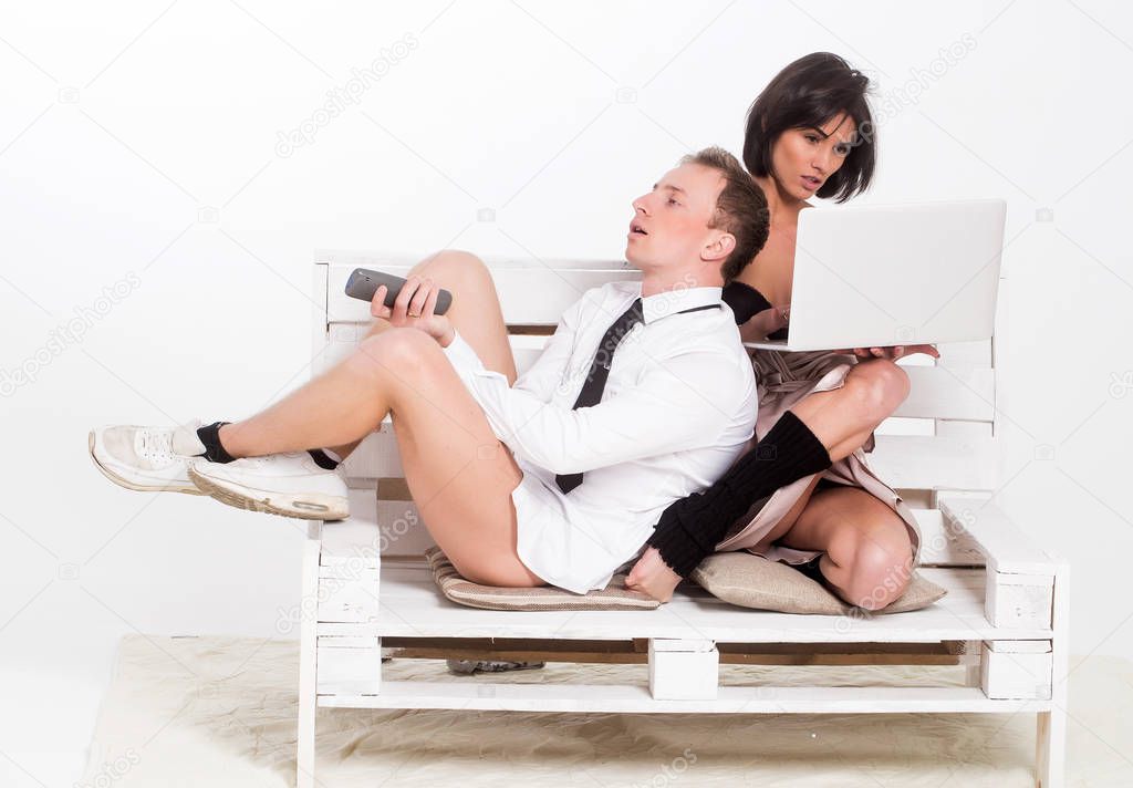 couple with laptop and remote