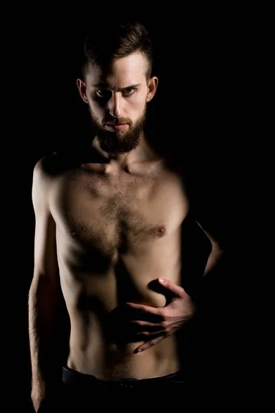 Slanke bebaarde man met dunne kale romp geïsoleerd op zwart — Stockfoto