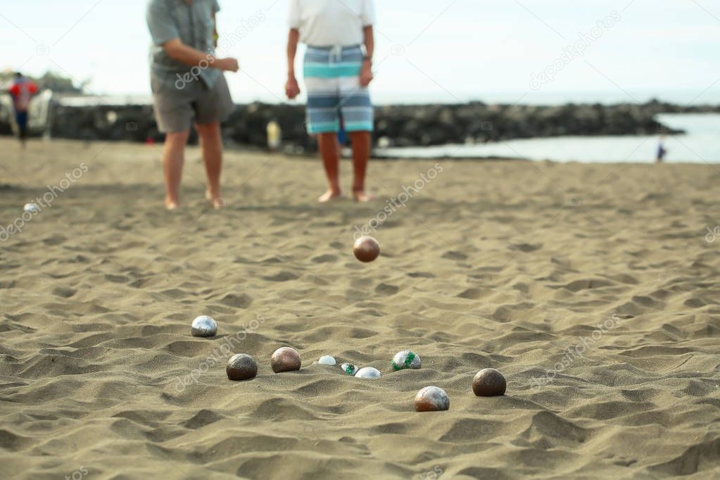 People or men play bocce sport with balls